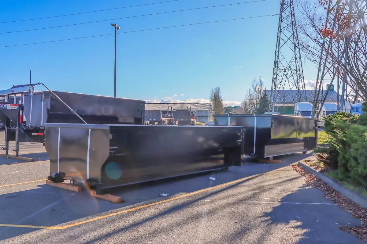 Roll-off dumpster ready for waste disposal at job site for 12 Yard Dumpster Rental in Valinda